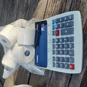 Cannon electric calculator with paper
